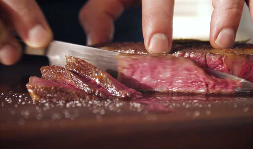 Slicing through a sous vide steak
